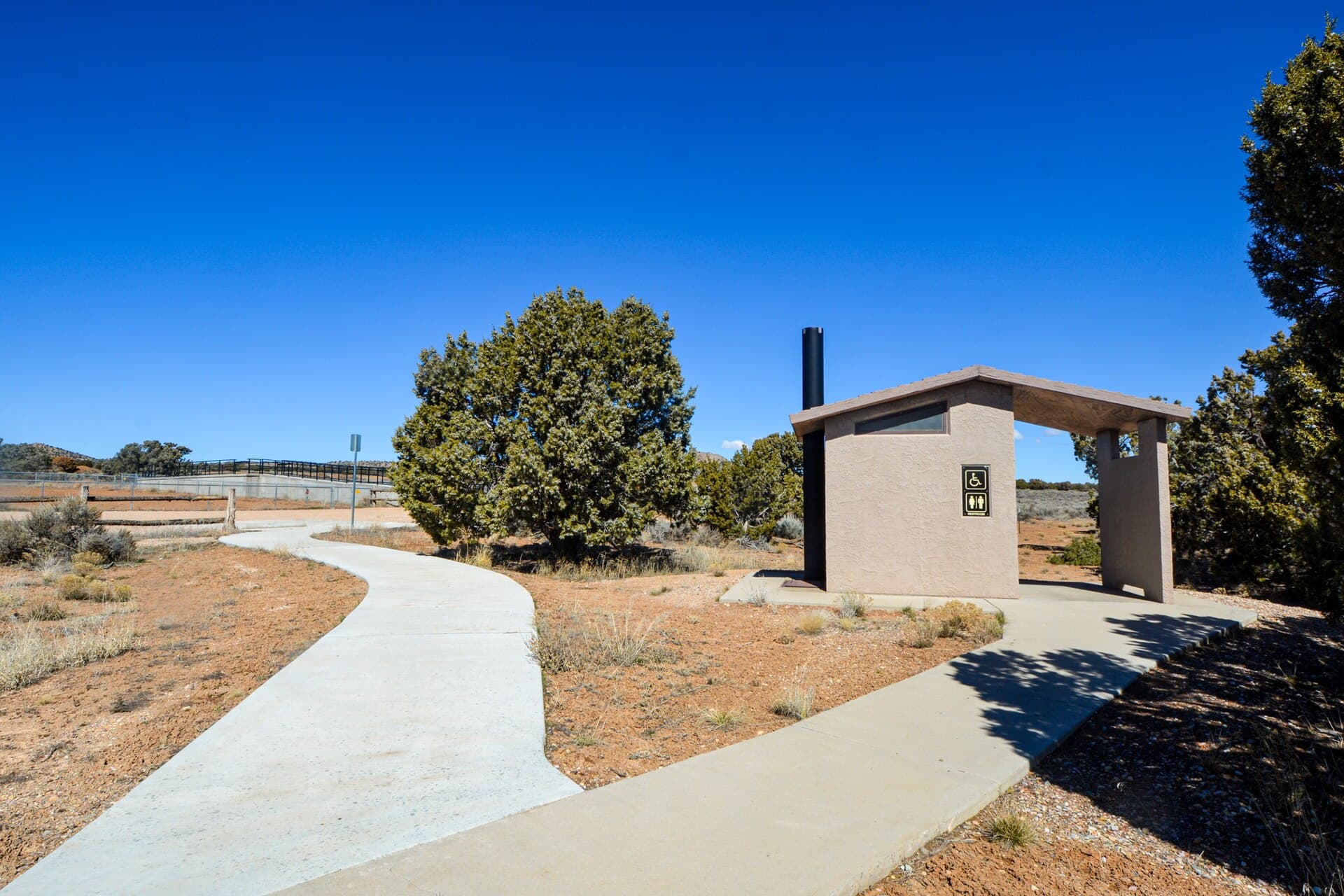 Accessible restroom facility with a level approach