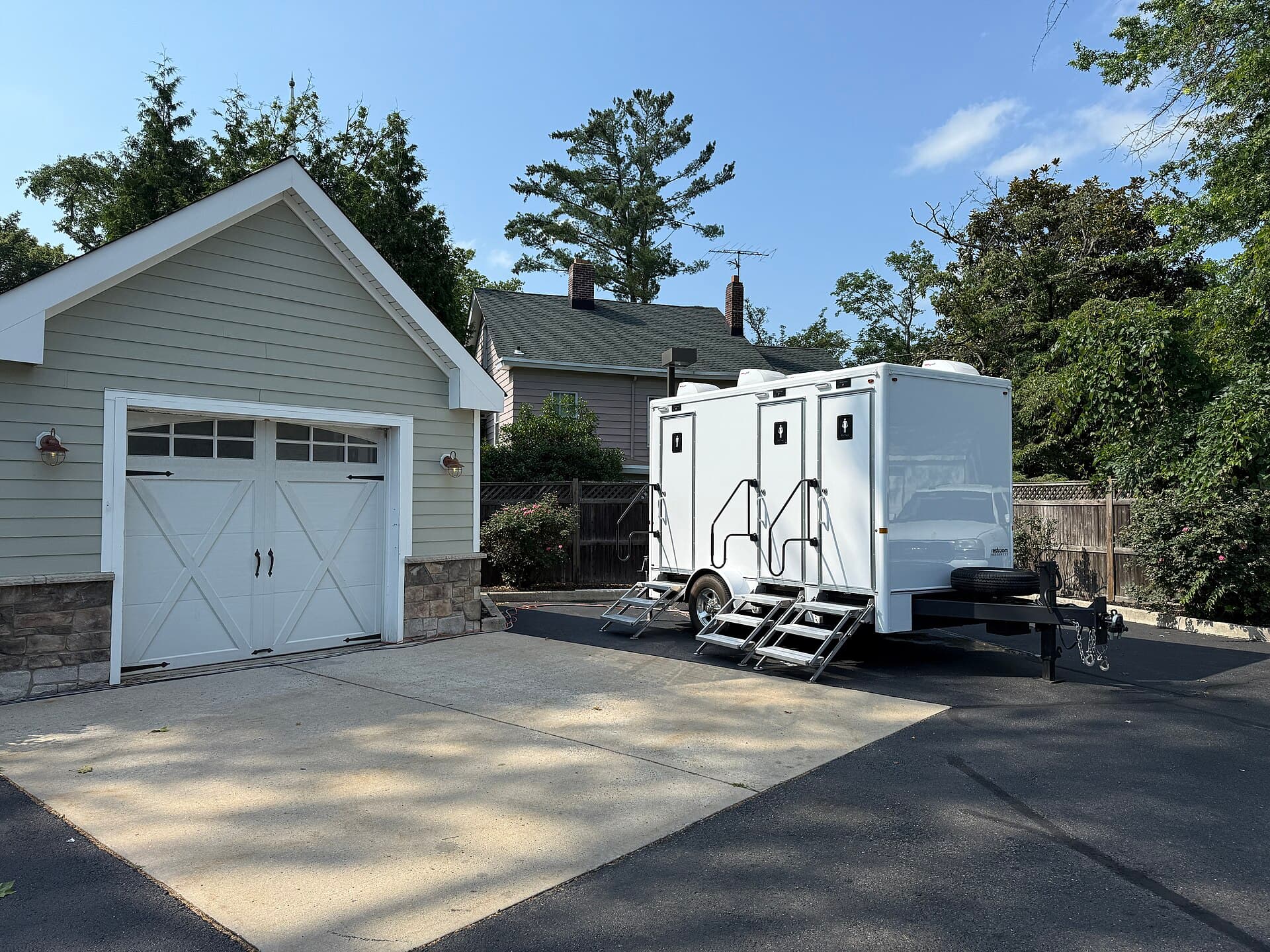 Restroom trailer positioned for a residential event